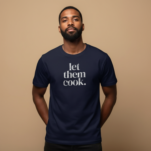 Male model wearing let them cook. t-shirt