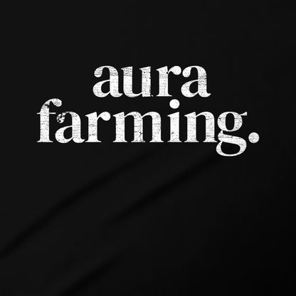 the text "aura farming" in a stylized font against a black background.