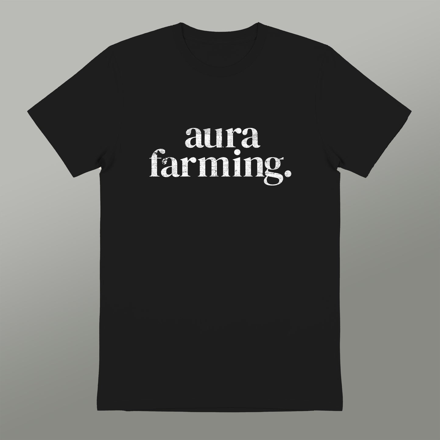 A black t-shirt with white text that reads "aura farming".