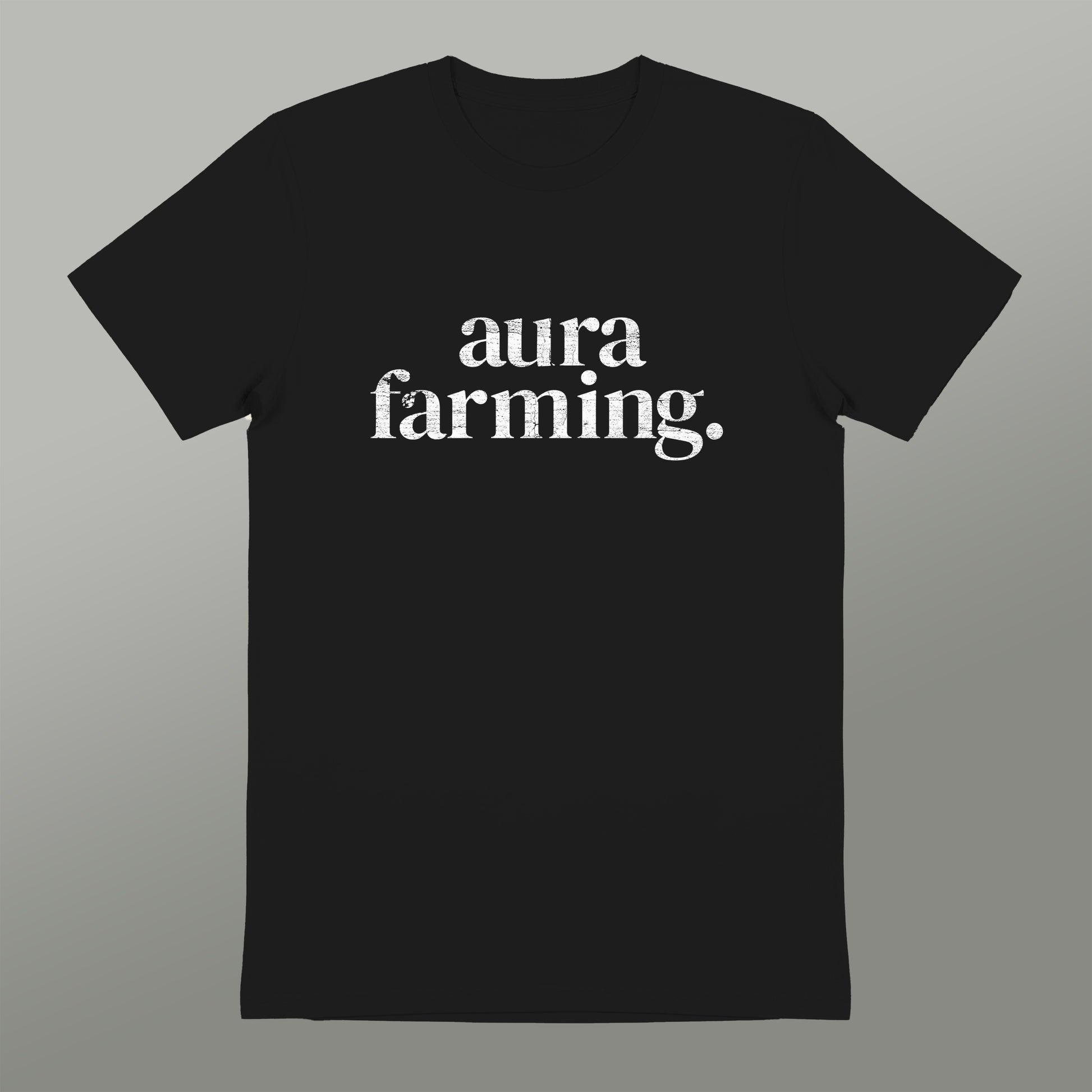 A black t-shirt with white text that reads "aura farming".