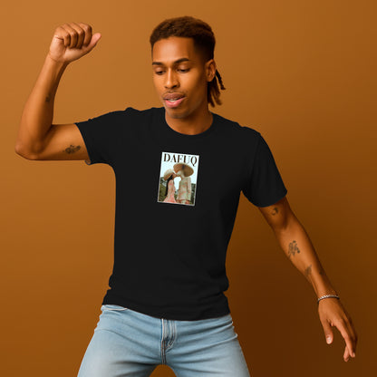 A man wearing a black t-shirt with a graphic design and a raised fist, standing against a brown background.