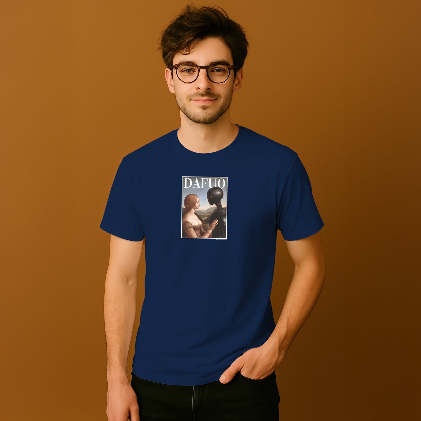 A man wearing a blue t-shirt with a graphic design on it, standing against a brown background.