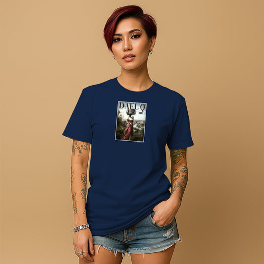 A young woman with short red hair wearing a navy blue t-shirt with a graphic design on it, standing against a beige background.