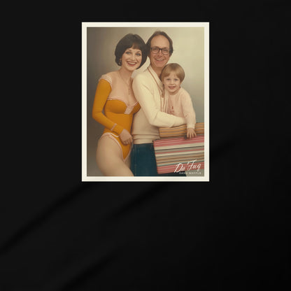 A family portrait of a man, woman, and child posing together, with the man holding a colorful striped object.
