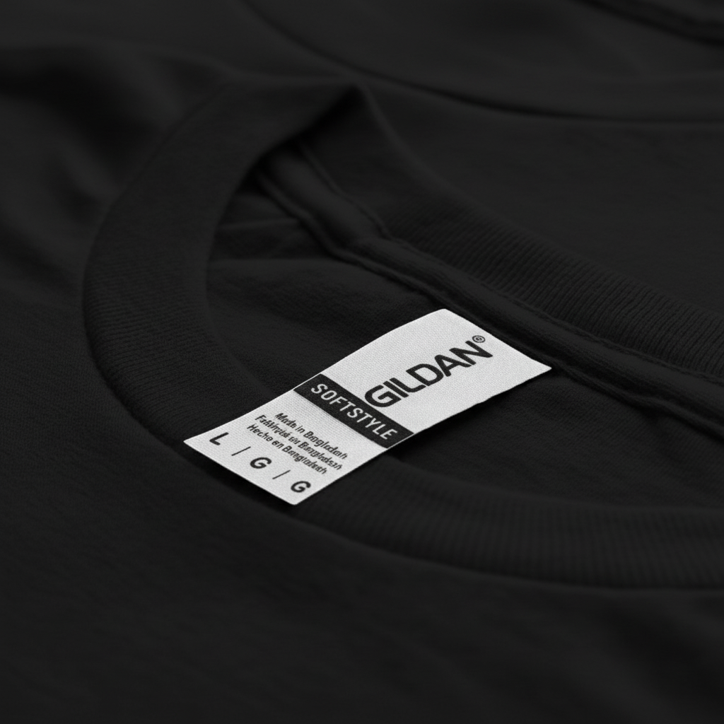 A close-up view of a black t-shirt with a label attached to it.