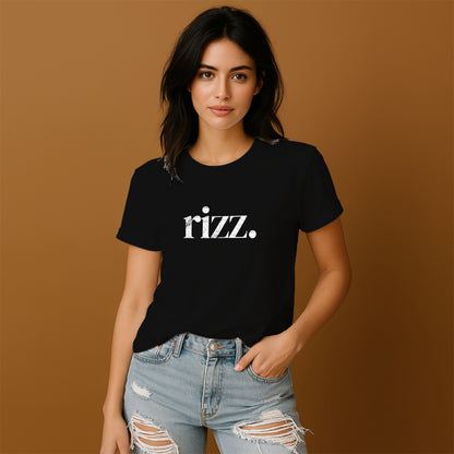 A young woman wearing a black t-shirt with the word "Razz" printed on it, paired with distressed jeans, stands against a brown background.