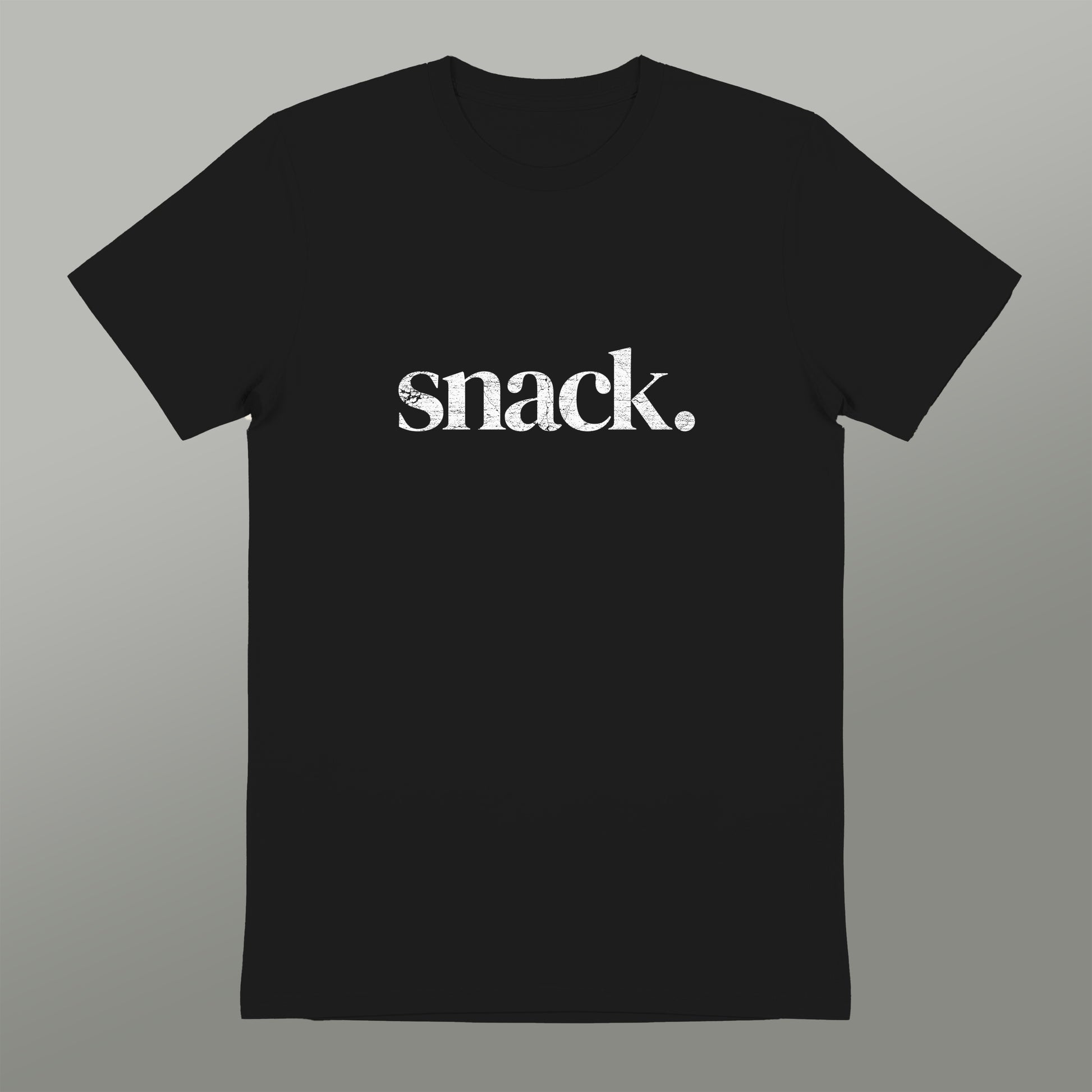 A black t-shirt with the word "snack" printed in white text.