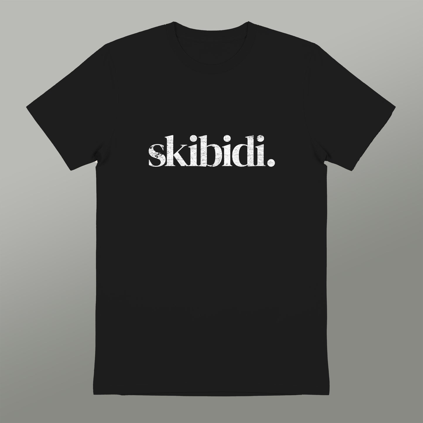 A black t-shirt with the text "skibidi" printed on it in white.