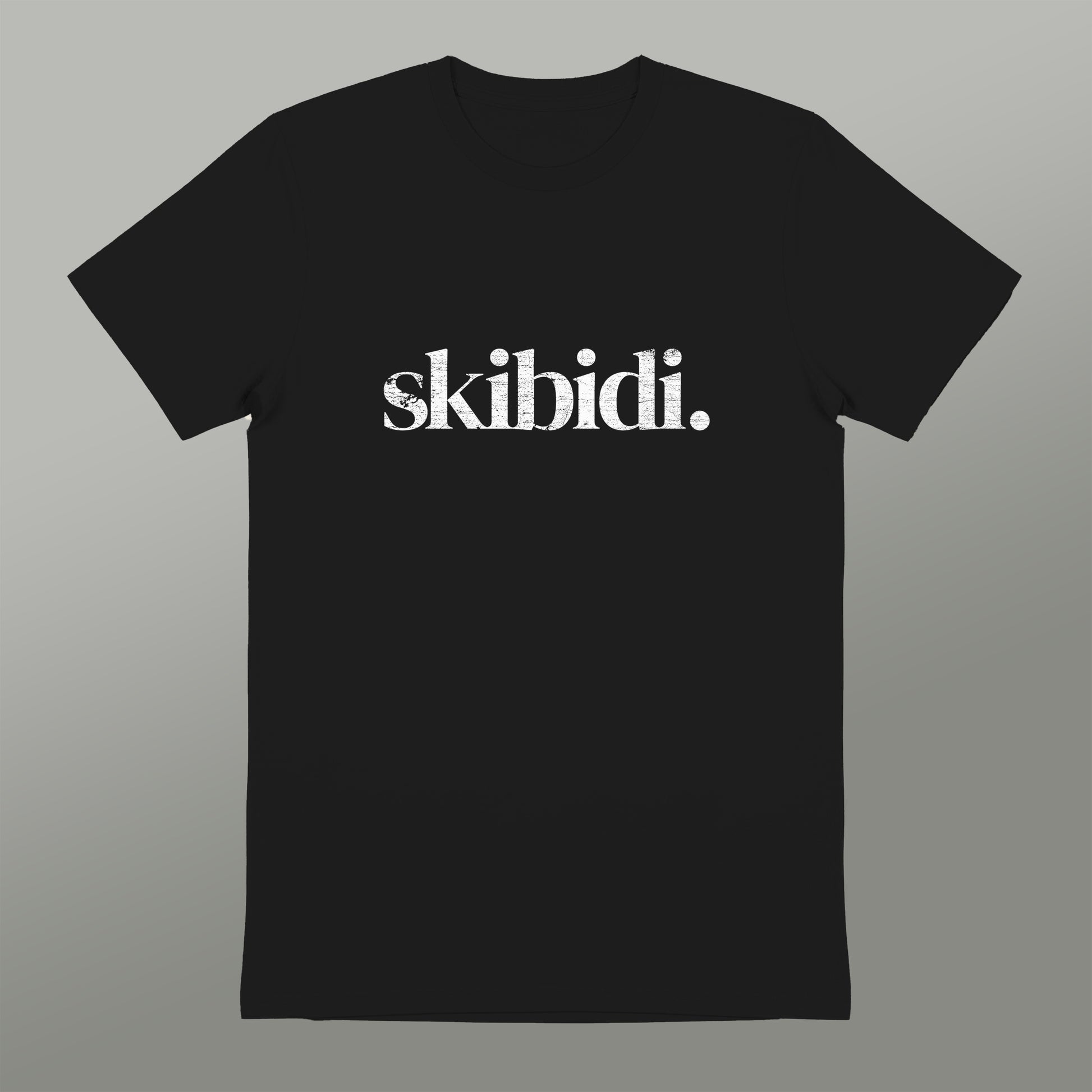 A black t-shirt with the text "skibidi" printed on it in white.