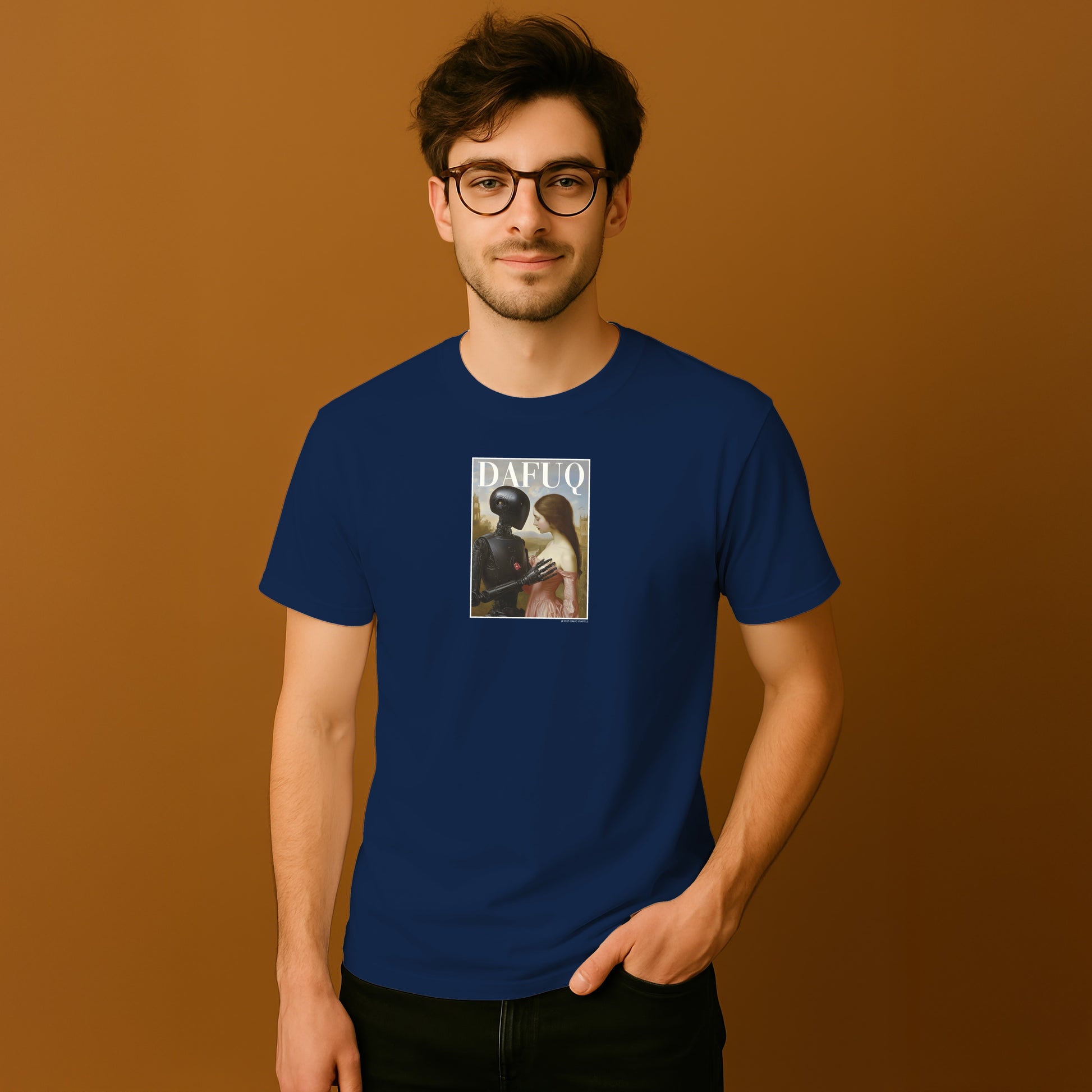 A man wearing a blue t-shirt with a graphic design on it, standing against a brown background.