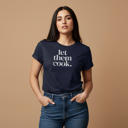 Female model wearing let them cook. t-shirt